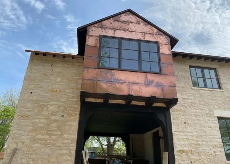 Copper metal panel facade on a stone building for Skylight Installation in West Norriton